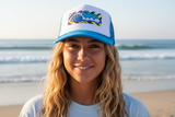 Person wearing a cap with a beach background